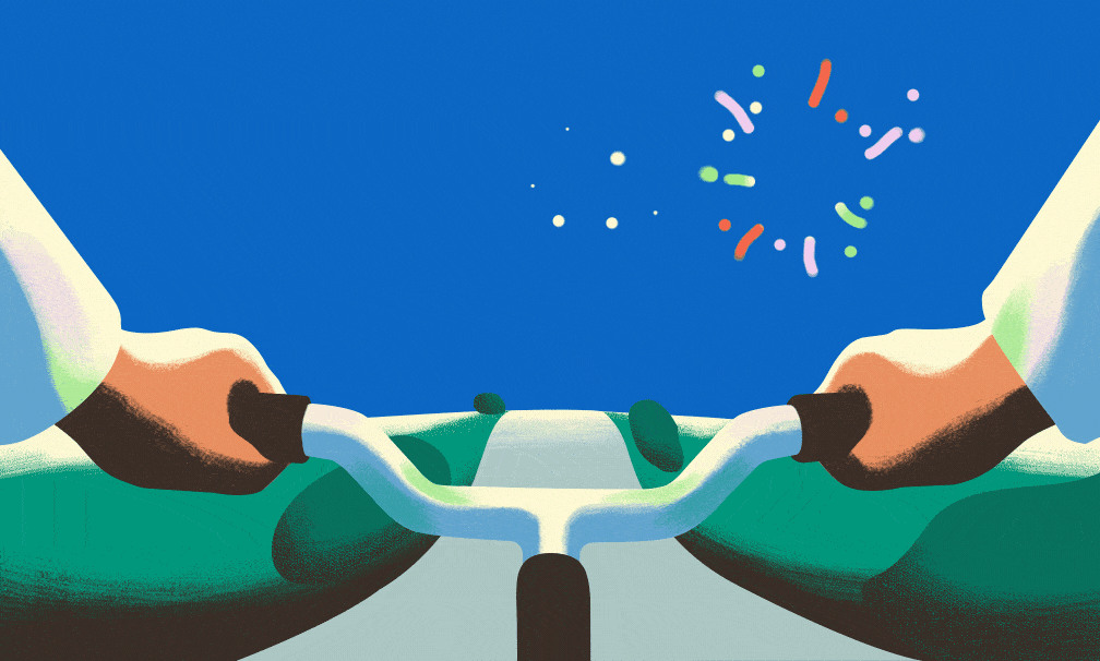 animated GIF of an illustration from the perspective of a cyclist riding toward a fireworks display